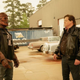 Robotman stares at Cliff Steele, his former human self, in a 1980s parking lot.